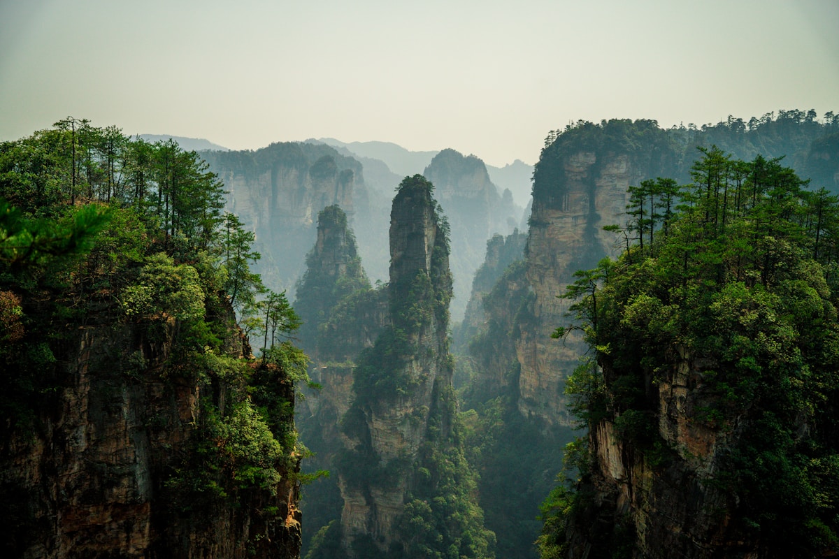 Misty clouds wrapping around Zhangjiajie mountain peaks